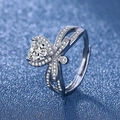 Silver heart-shaped ring with bow design and adjustable open band on blue glitter background - White Gold Ljz-189 / Adjustable Open