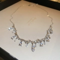 Silver branch necklace with water drop crystals on a jewelry card display - 30# Necklace-Silver