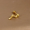 Macro shot of gold-plated snake ear stud with sparkling cubic zirconia and screw back - Snake Shape / Gold