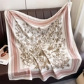 Detail of vintage floral pattern on a silk scarf draped over a brown leather sofa - Thistle Floral Print Pink (XW-195)