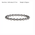 Detail view of 6mm silver stainless steel beaded bracelet with textured barrel beads - 6mm