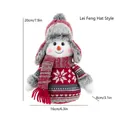Knitted snowman plush toy in red trapper hat style for Christmas window decoration - Lei Feng Hat Style