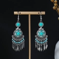 Close-up of bohemian tassel earrings with turquoise beads and silver dangles - E6463 Antique Silver Turq