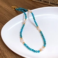 Star and moon necklace with blue faceted beads, pearls and gold spacers in variant view - 26# Sky Blue Faceted Gemstone Baroque Pearl Necklace