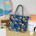 Canvas tote bag with flamingo and tropical leaf print featuring grey handles and a black base - Flamingo