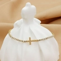 Elegant gold-plated tennis bracelet with a zircon-encrusted cross charm on display - Bracelet No. 9 (B0053)