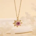Macro detail of 18K gold plated evil eye pendant with pink iris on warm beige background - Pink Purple Round-F3