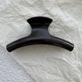 Close-up of curved dark brown glossy PC shark hair claw clip for thick hair styling - Dark Coffee