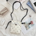 Detail of floral crossbody canvas bag with woven rope strap and drawstring on white fabric - Small Flower White