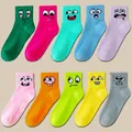 Ten pairs of colorful crew socks with assorted cartoon smiley face embroidery on the rib cuff - Multicolor (Expressions)