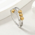 Crossed line stainless steel anxiety ring with four sliding gold beads for stress relief - US 8 / Gold and Silver