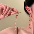Detail of pink and red beaded long tassel earrings with golden metal chains for summer - Golden Chain Pink Crystal Style (17#)
