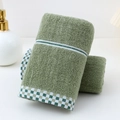 Absorbent green cotton towel featuring a stylish checkered decorative border and soft texture - Cotton Houndstooth Green (Towel)