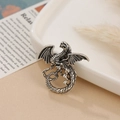 Vintage silver dragon brooch with detailed wings and scales on a ceramic tray - Antique Silver Dragon Style 5