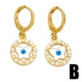 Gold butterfly earrings with blue evil eye charms and white zircon crystals on white background - Gold Butterfly Style (B)