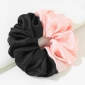 Oversized satin hair scrunchie in contrasting black and soft pink color block design - Black and Pink