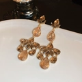 Elegante champagne kristallen kroonluchter oorbellen met een gepolijste gouden finish - Champagne Meerlagige Hangerstijl