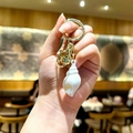 Exquisite white conch shell acrylic keychain with a golden metal ring and bell detail - Small White Conch