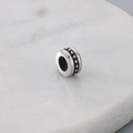 Cylindrical silver titanium steel bead with black floral patterns on marble base - Black Textured Polka Dot Decoration (KLJ9058-KJX)