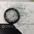 Silver hollow round nail art charms with textured edges in a sleek black container - 16# Donut