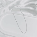 Detail of minimalist silver-plated chain necklace on elegant white silk tray - Round O-Link Chain / 45cm / Silver