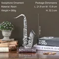 Scultura retrò di sassofono su base libro 28cm per decorazione armadio vintage - Argento