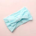 Close-up detail of soft light blue baby jacquard headband with a large decorative bow - Sky Blue
