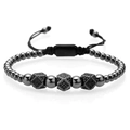 Black beaded bracelet with cubic metal charms and adjustable braided cord in macro view - Black Polygon Style