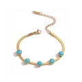 Detail of gold snake chain bracelet with turquoise beads and S.STEEL engraving - Round Blue Bead(31646) / Gold