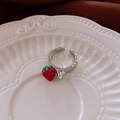 Macro shot of silver strawberry earring with green leaves and a sparkling heart zircon - Silver Adjustable Strawberry Ring (Single Zircon)