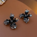 Vintage style cross floral earrings featuring faceted black crystals and dark grey stones - Black Camellia Flower Style