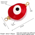 Natural freshwater pearl charm with red evil eye enamel detail and gold plated rings - Red Evil Eye (L344499)