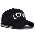 Black cotton baseball cap featuring LOVE embroidery and decorative ribbon on the side - Adjustable / Black