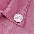 Pink enamel horror movie lover badge with chainsaw design on denim jacket - Final Girl Support Club (XZ8911)