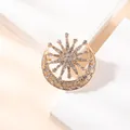 Macro detail of crescent moon and sunburst brooch with inlaid rhinestones on gold alloy - BZ05-Celestial Combo
