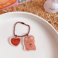 Cute acrylic teddy bear keychain with heart charm and bubble tea design on bead chain - Eat More Stay Fit Bear