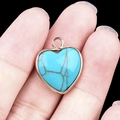 Handheld heart-shaped turquoise pendant with golden metal border and brown texture - Synthetic Turquoise Gold Edging