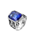 Detailed macro view of silver signet ring with blue gemstone and Freemasonry engraving - Steel Light Blue