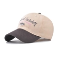 Close-up of letter embroidery on a two-tone beige and brown cotton baseball cap - M / Gray