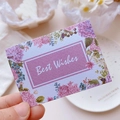 Minimalist purple floral greeting card with Best Wishes text held in a bright setting - Purple Hydrangea