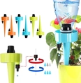 Adjustable garden drip irrigation spikes in blue, green, and orange for plant watering - 2PCS Plant Drippers