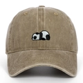 Close-up of vintage washed khaki baseball cap featuring panda embroidery detail - Khaki
