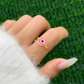 Macro shot of handmade gold wire-wrapped ring with pink evil eye bead detail - Style 1 Gold+Pink (0581)
