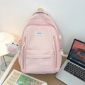 Pink quilted bubble backpack with a white plush bunny keychain and logo label - Pink