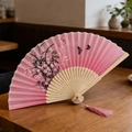 Pink Chinese folding fan with black ink floral pattern and butterfly, featuring pink tassel - Style 59 (New Style)