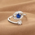 Silver adjustable Evil Eye ring with blue and white crystals on textured brown fabric - Multi-layer Pave Evil Eye (Q-J088) / White Gold