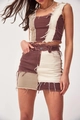 Detailed shot of two-piece denim set with patchwork design and frayed hem edges - XS / Coffee
