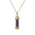 Detailed close-up of a golden perfume bottle pendant filled with dark blue crushed stones - 304 Gold Lapis Lazuli
