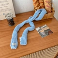 Slim light blue mohair knitted scarf with Vegetable label on warm wood background - Sky Blue