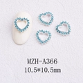 Close-up of 10.5mm hollow heart nail charm with lake blue rhinestones on a white nail model - Large Blue Gem Hollow Style(A366)